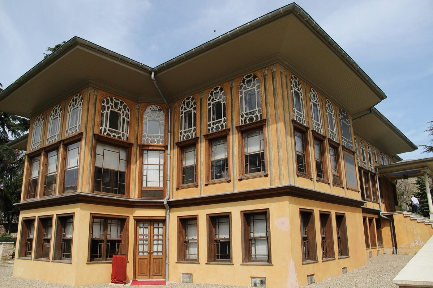 A corner of Aynalıkavak Pavilion seen from below, showing two storeys of windows with ornamental upper frames under deep eaves