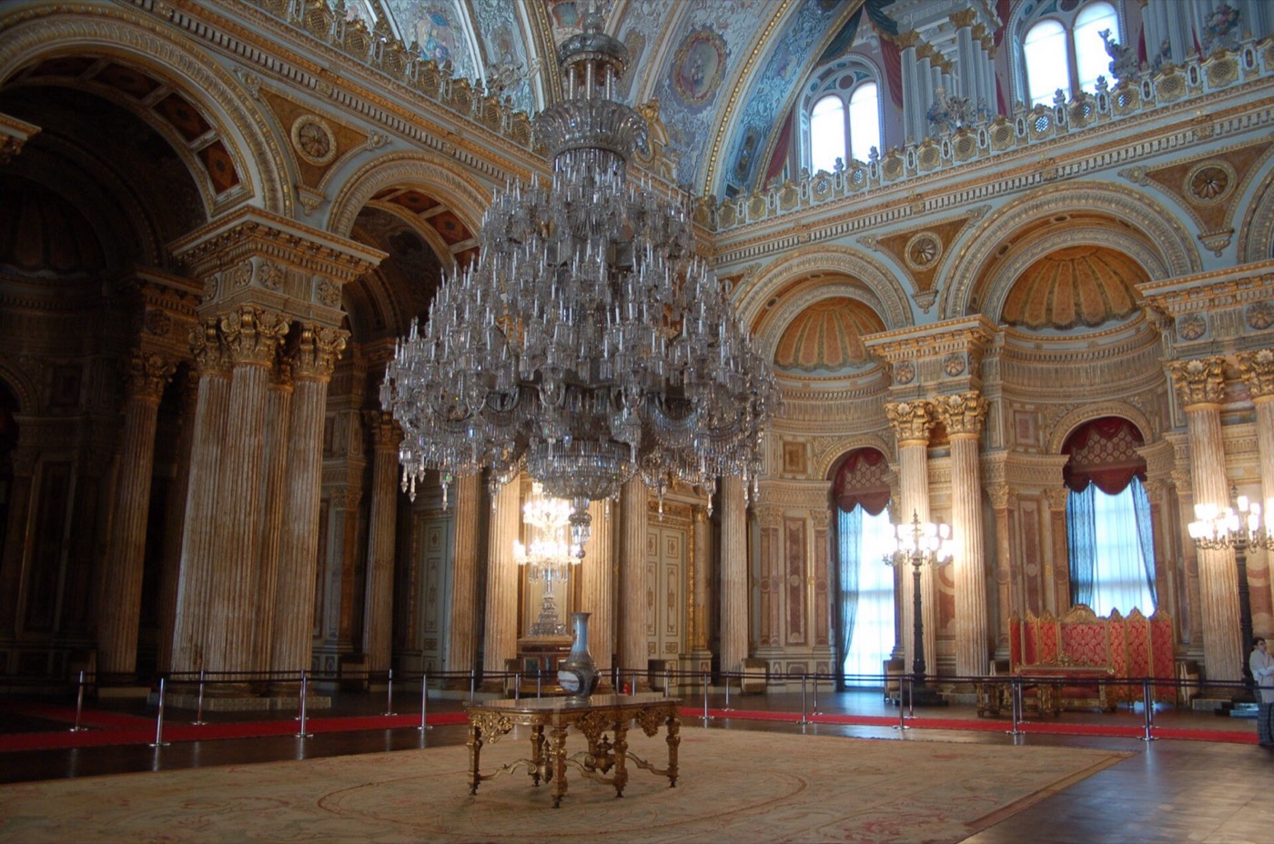 The Ceremonial Hall of Dolmabahçe Palace, with its giant crystal chandelier hanging under the dome between tall painted columns and arched windows