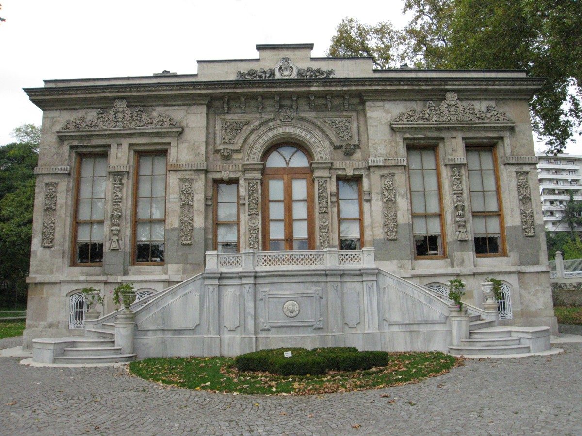 The plainer stone front of the Retinue Pavilion at Ihlamur, with a short double stair and a small lawn in front