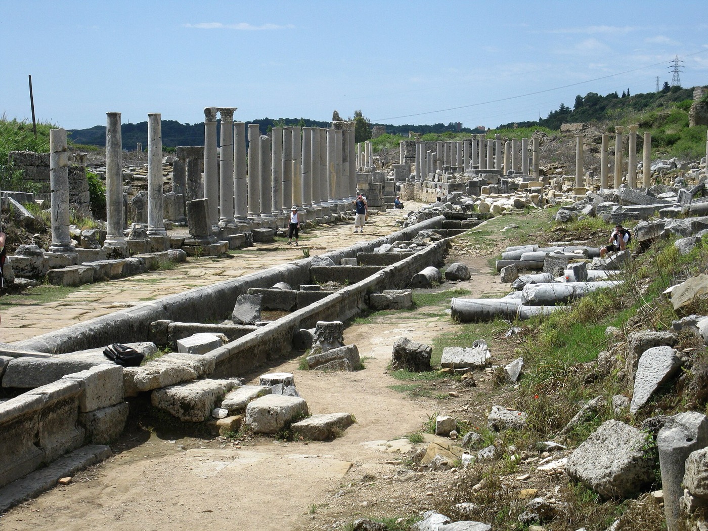 The colonnaded main street of Perge with the stone water channel running down its centre