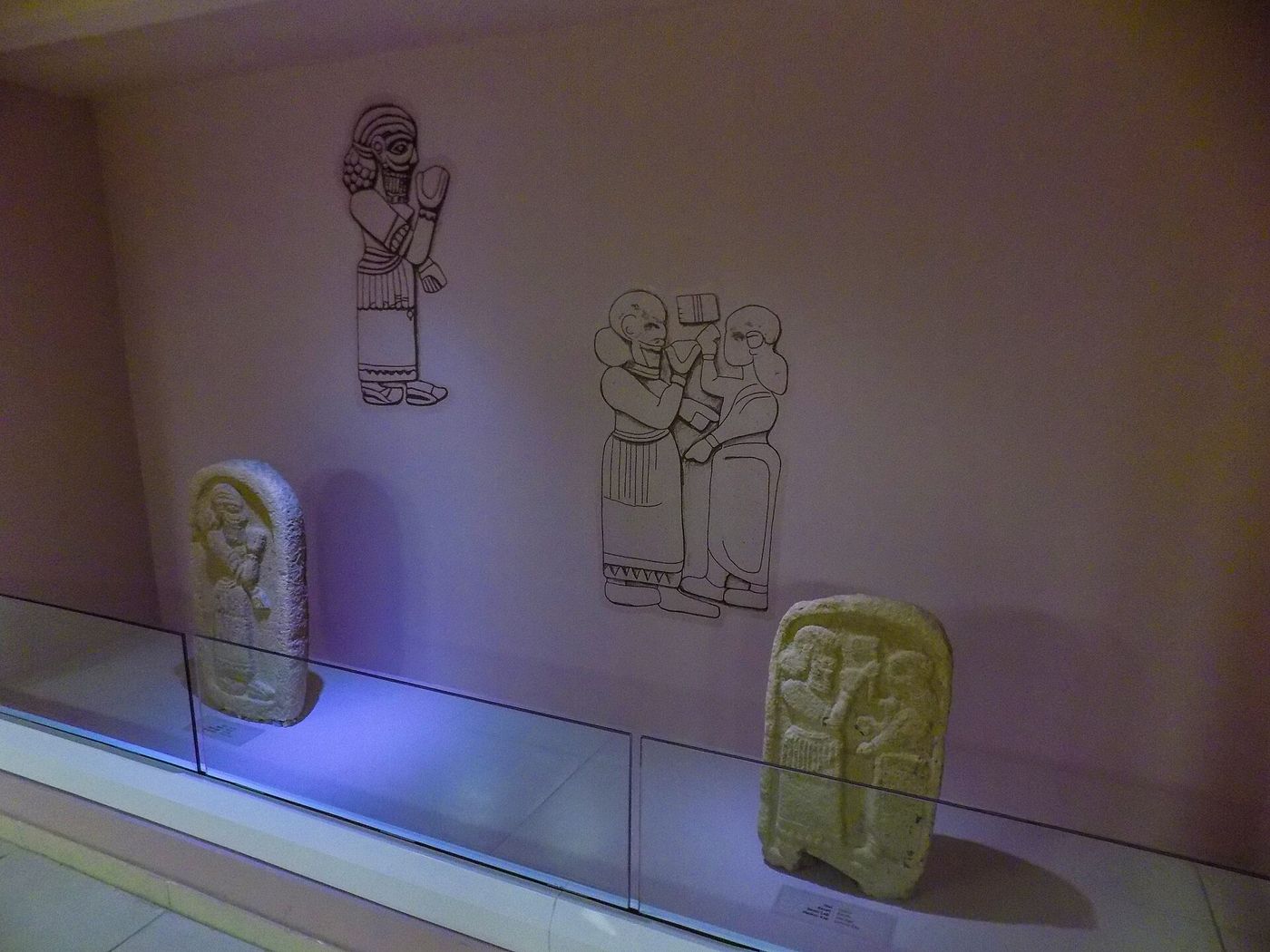 Iron Age stelae in a lit display case at the Şanlıurfa Archaeology and Mosaic Museum
