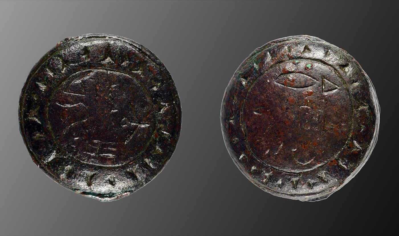 The two faces of the bronze Luwian seal found at Troy, its hieroglyphs ringed by a border of wedge marks
