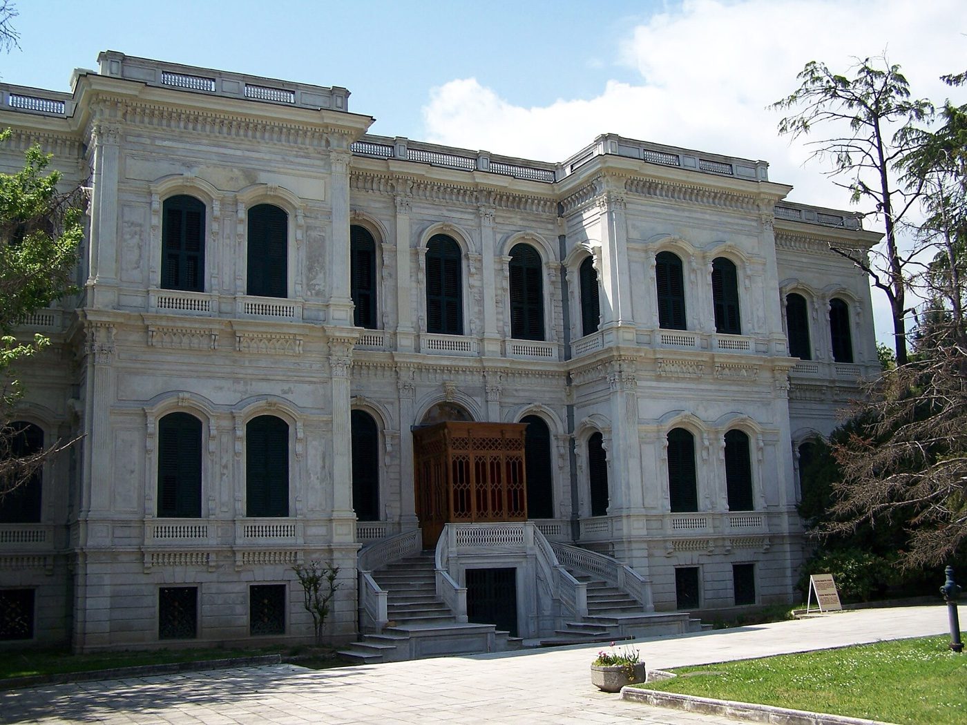 The white stone façade of the Great Mabeyn Pavilion at Yıldız Palace, with a double stair to the entrance and a paved forecourt
